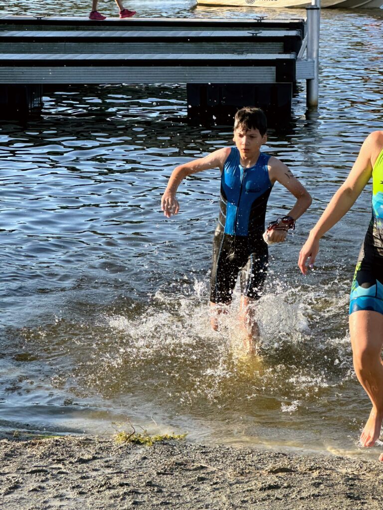 Splashing out of the water after the swim